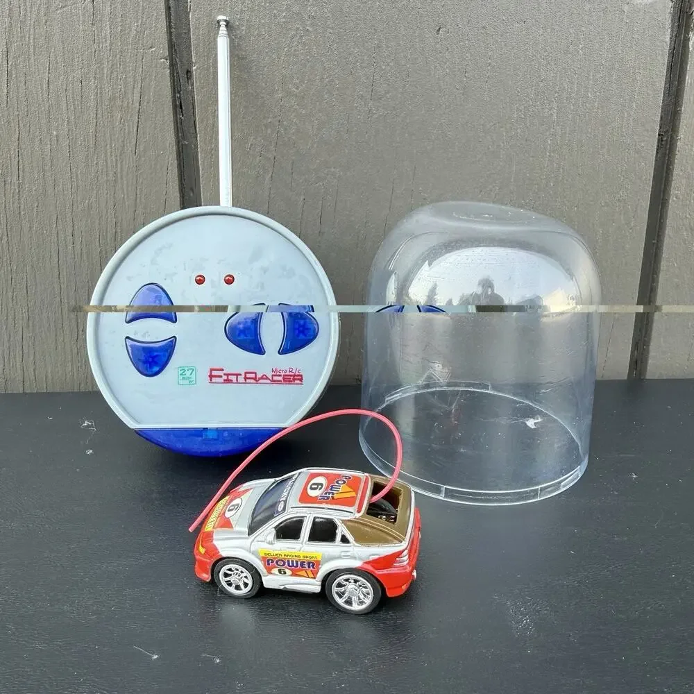 Vintage Remote Controlled Micro Car Mini Master racer. Charges And Works
